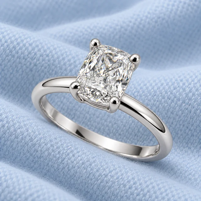 Essential PS Solitaire Ring on softly folded pale ice-blue cashmere