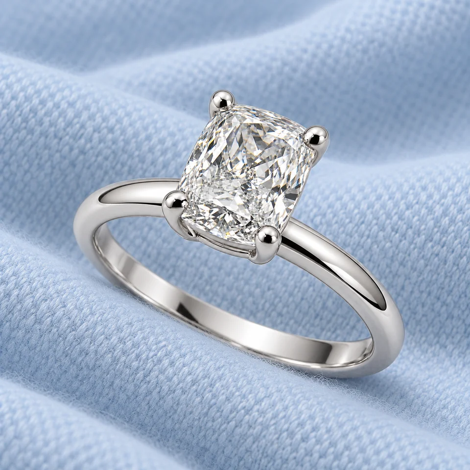 Essential PS Solitaire Ring on softly folded pale ice-blue cashmere