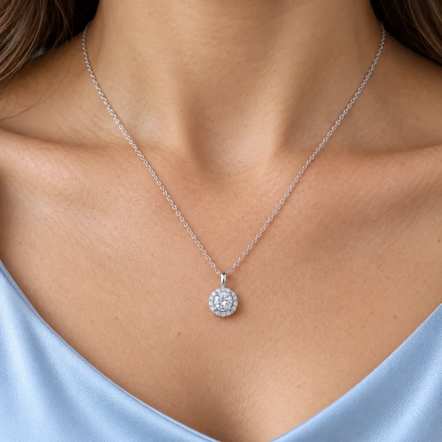 Jennifer Pendant worn at the collarbone with pale-blue silk
