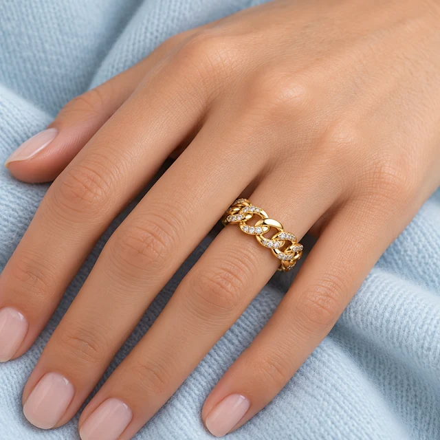 Liaison Yellow-Gold Ring worn on the hand beside pale-blue fabric