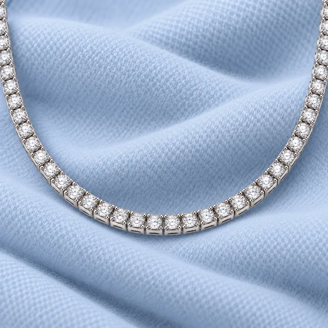 Piramide Diamond Necklace on softly folded pale ice-blue cashmere