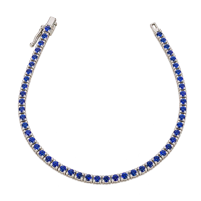 Tornito Sapphire Tennis Bracelet with a single row of blue sapphires and a polished gold clasp