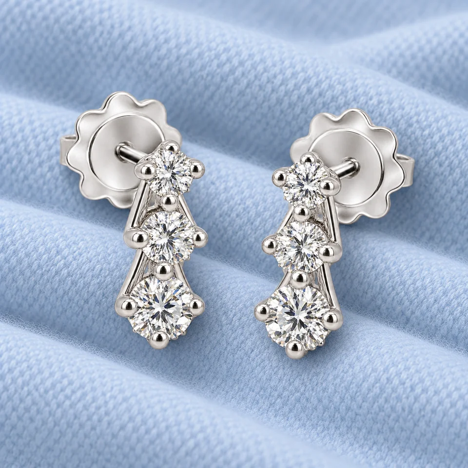 Trilogy Scalare Flower Earrings on softly folded pale ice-blue cashmere