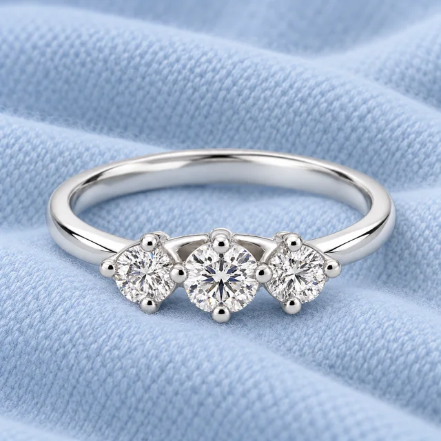 Trilogy Scalare Flower Ring on softly folded pale ice-blue cashmere