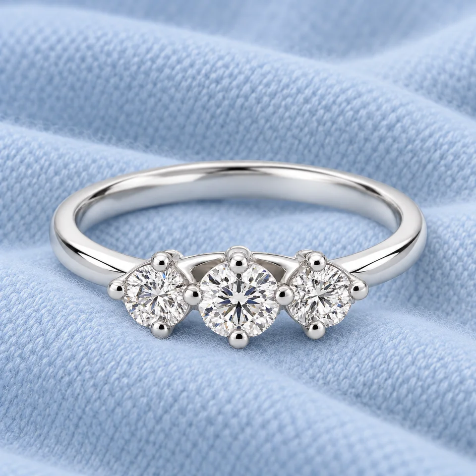 Trilogy Scalare Flower Ring on softly folded pale ice-blue cashmere